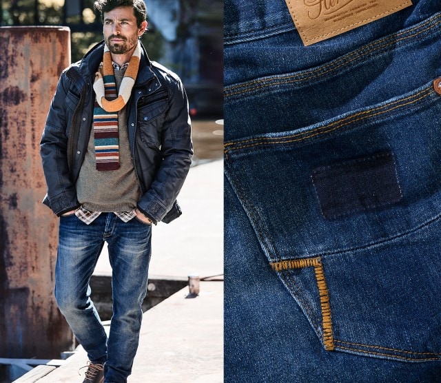 Mann mit Jacke und Jeans geht spazieren