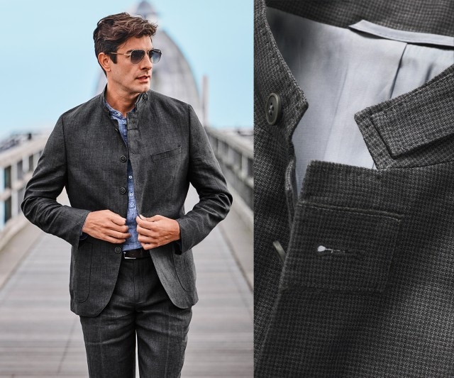 Auf dem Bild trägt ein Mann einen anthrazitfarbenen Anzug mit Stehkragen und eine hellblaue Hemdbluse, dazu Sonnenbrille; rechts ist eine Detailaufnahme des Kragens und Stoffs des Sakkos zu sehen.