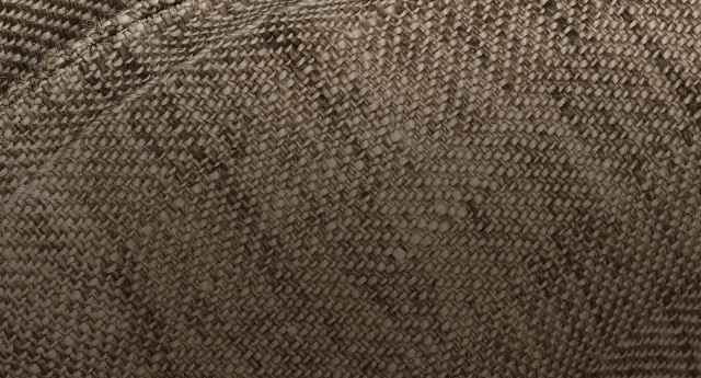 Nahaufnahme einer braunen Textur mit einem diagonalen gewebten Muster.